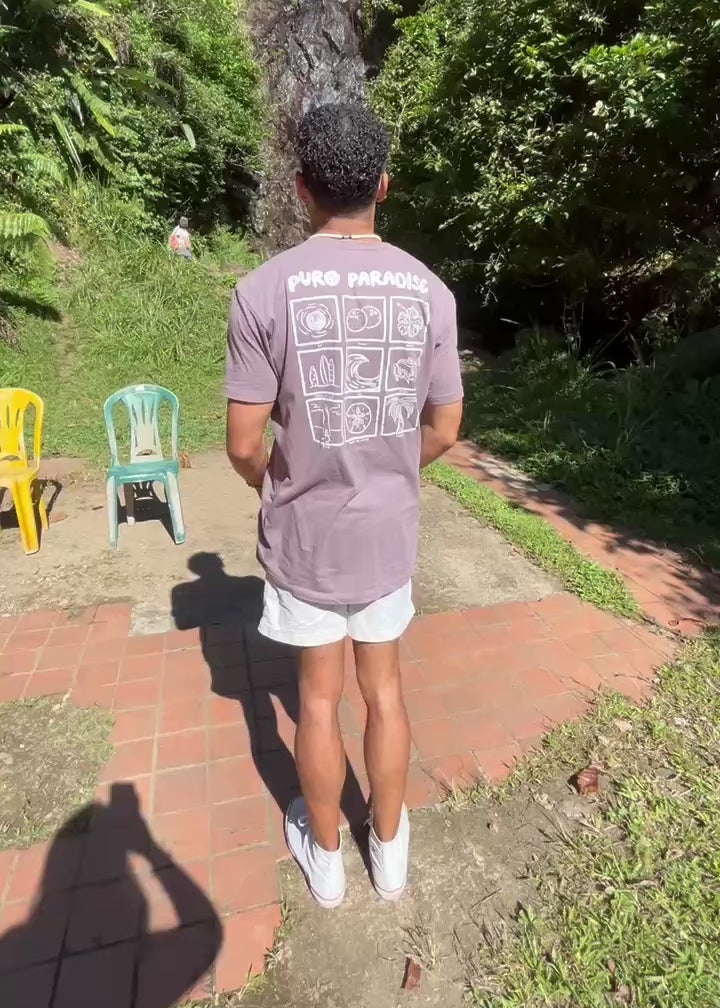 man wearing puro paradise tshirt at river